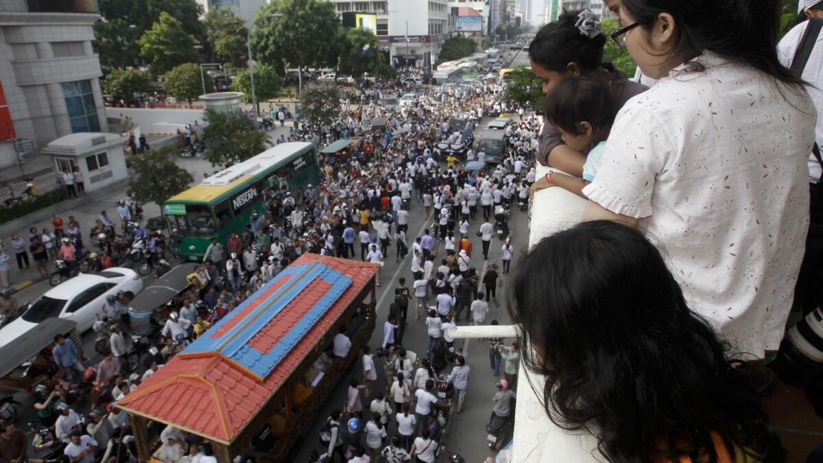 Tens of thousands marched in the funeral procession for Kem Ley in Phnom Penh, Cambodia, on July 24, 2016. Ley, 45, was fatally shot in an attack that raised suspicion of a political conspiracy.