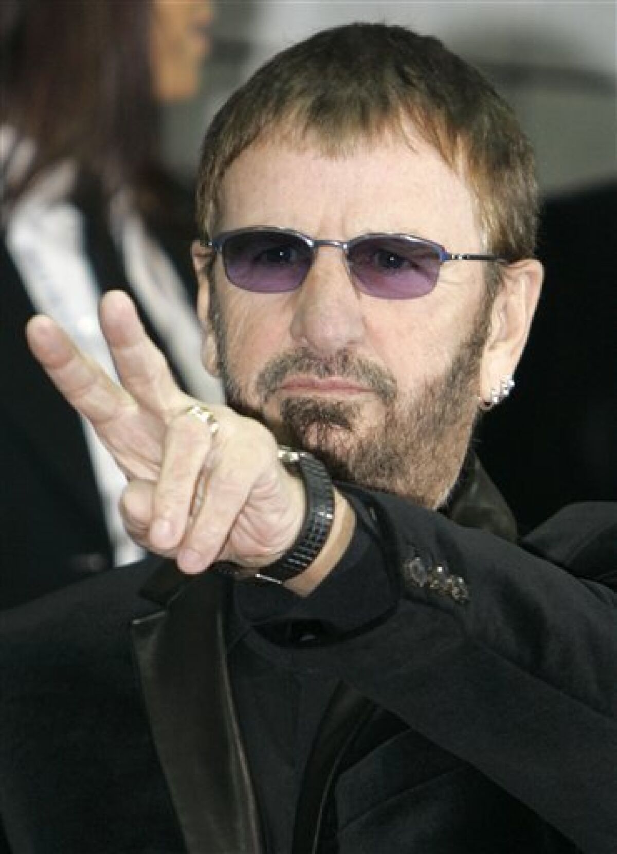 FILE - In this Nov.9, 2008 file photo, British singer Ringo Starr arrives at the 2008 World Music Awards ceremony in Monaco. In 2005, the Beatles’ Ringo Starr took up residency in Monaco, where he gets to keep a higher percentage of royalties than he would in Britain or Los Angeles. France’s tiny neighbor Monaco, with zero percent income tax for most people, has obvious appeal for the 72-year-old drummer and his estimated $240 million fortune.(AP Photo/Lionel Cironneau, File)