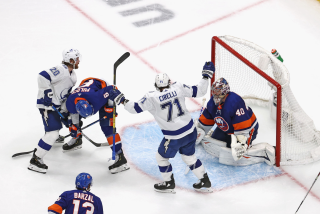 Tampa Bay's Anthony Cirelli #71 of the Tampa Bay Lightning celebrates his series winning goal against Semyon Varlamov.