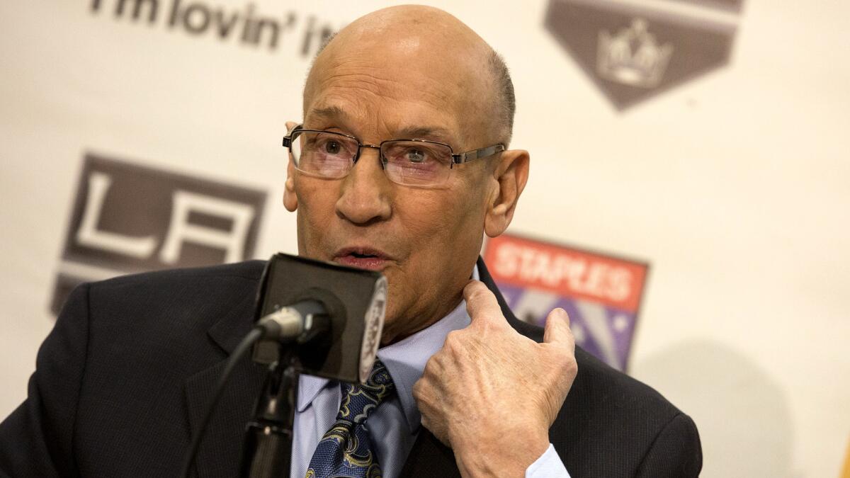 Kings announcer Bob Miller points to his carotid artery while explaining his health concerns as he announces his retirement on Thursday.