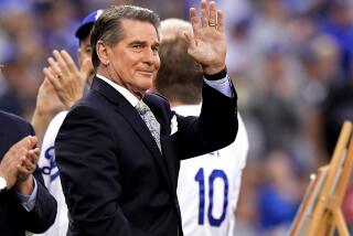 Former Dodger Steve Garvey waves to fans prior to a baseball game on Saturday, June 1, 2019, in Los Angeles.