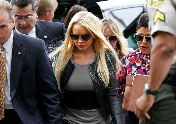Lindsay Lohan arrives at the Beverly Hills Courthouse to begin serving her 90-day sentence for a probation violation.