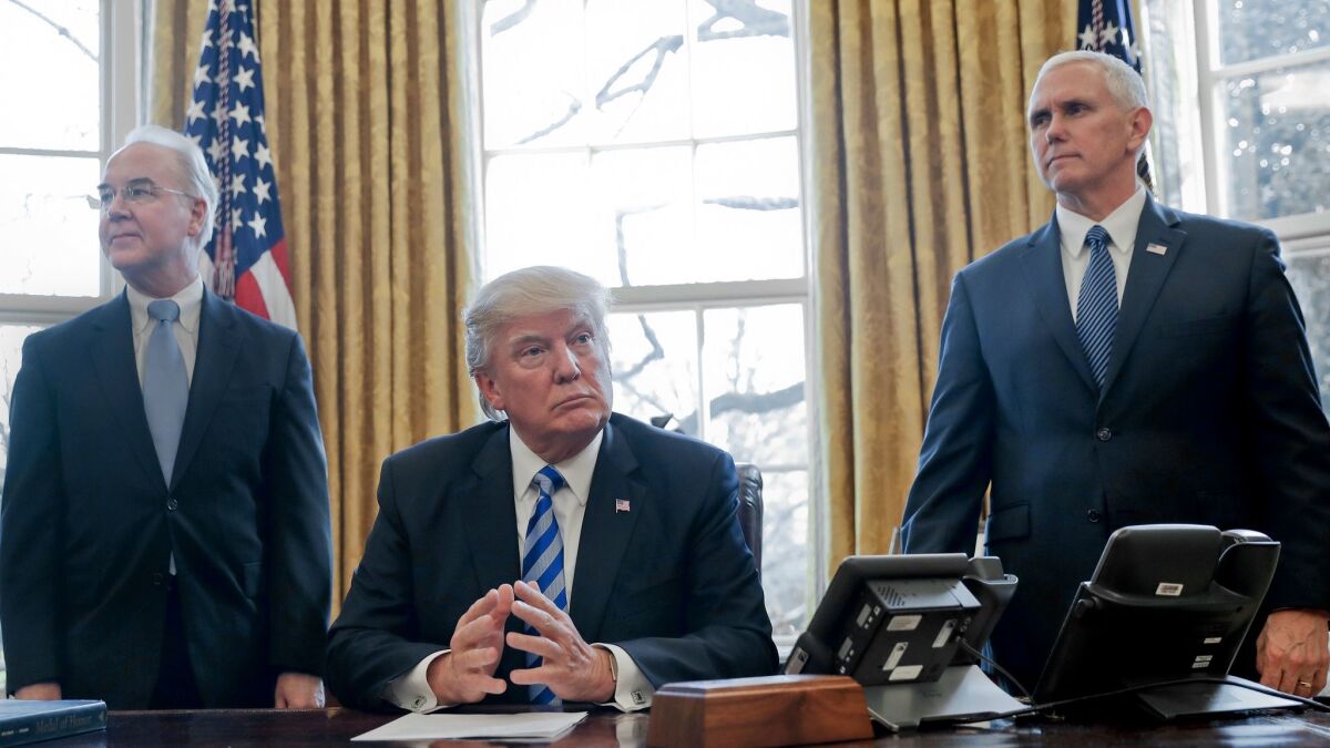 Will Obamacare explode? The fuse is in their hands: President Trump, flanked by Health and Human Services Secretary Tom Price, left, and Vice President Mike Pence.