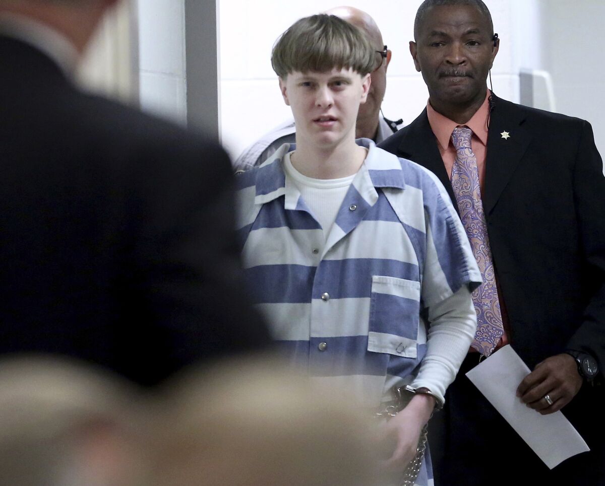 Dylann Roof walks into court in 2017.