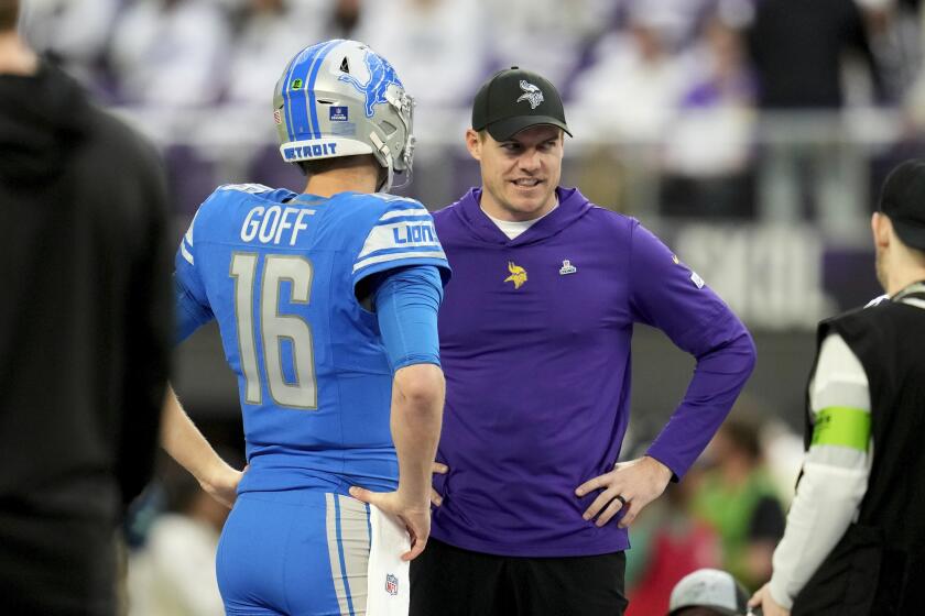 Minnesota Vikings head coach Kevin O'Connell talks with Detroit Lions quarterback Jared Goff (16) before an NFL football game, Sunday, Dec. 24, 2023, in Minneapolis. (AP Photo/Abbie Parr)