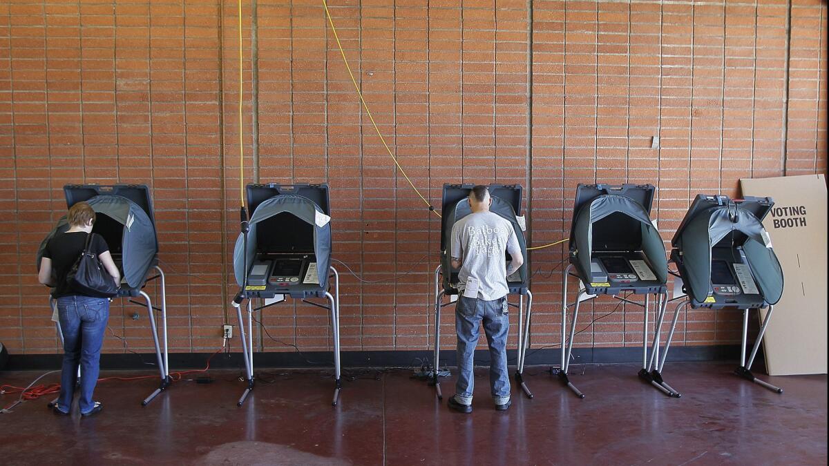 Voters cast their ballots on election day at the Balboa Peninsula Fire Station No. 1 on June 5, 2012.