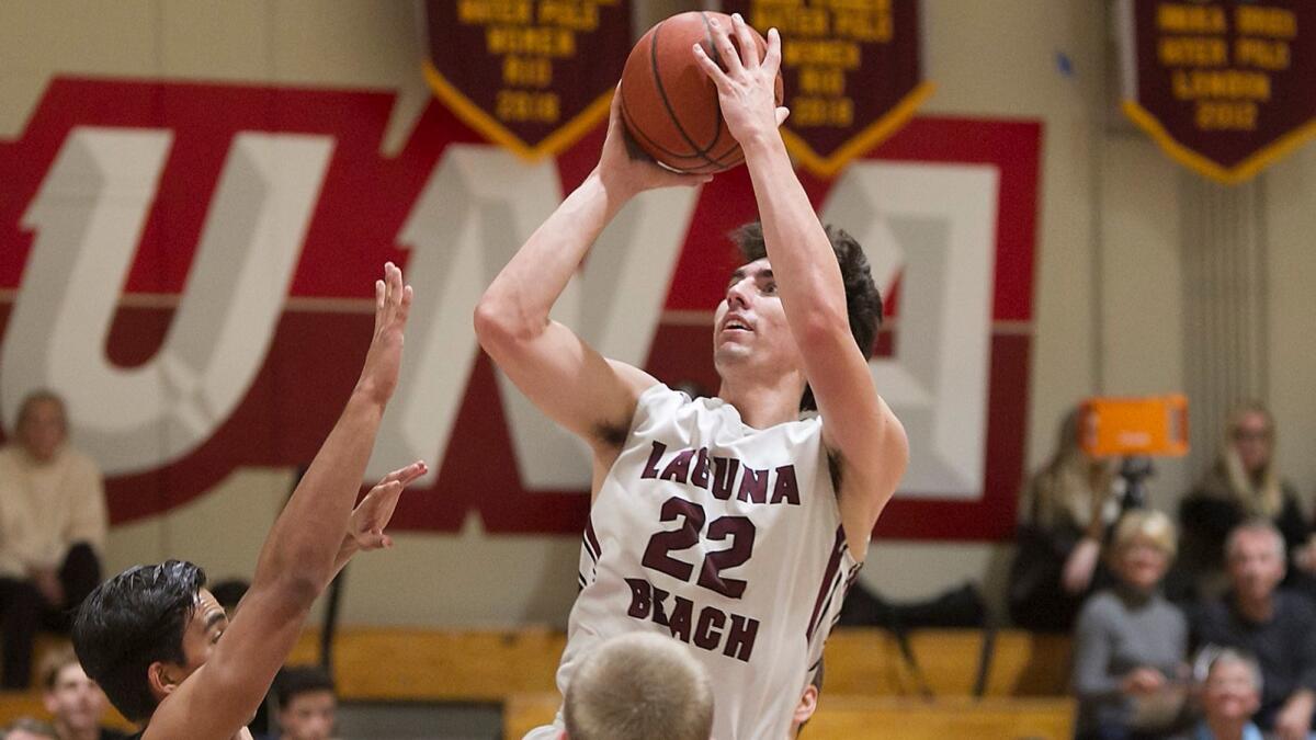 Blake Burzell (22) and his Laguna Beach High boys' basketball team received the No. 2 seed in the CIF Southern Section Division 3AA playoffs on Sunday.