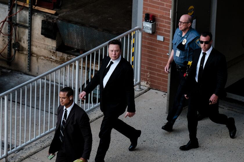 WILMINGTON, DE - JULY 12: Tesla Founder Elon Musk leaves a courthouse after testifying in a court case on July 12, 2021 in Wilmington, Delaware. Musk testified in court over Tesla's $2.6 billion acquisition of SolarCity, a rooftop solar panel installer. (Photo by Michael A. McCoy/Getty Images)