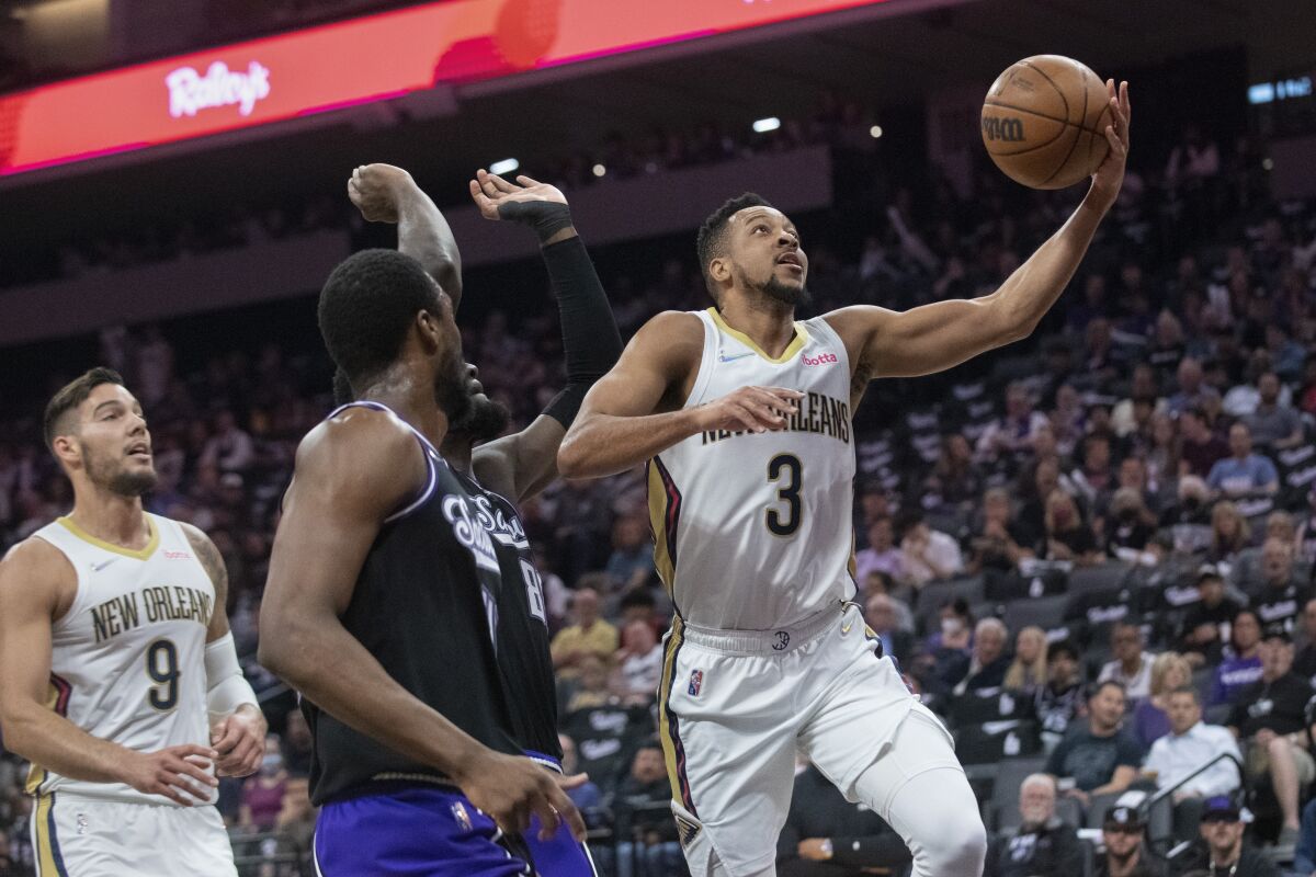 New Orleans Pelicans guard CJ McCollum (3) lays the ball up during the first quarter of the team's NBA basketball game against the Sacramento Kings in Sacramento, Calif., Tuesday, April 5, 2022. (AP Photo/Randall Benton)