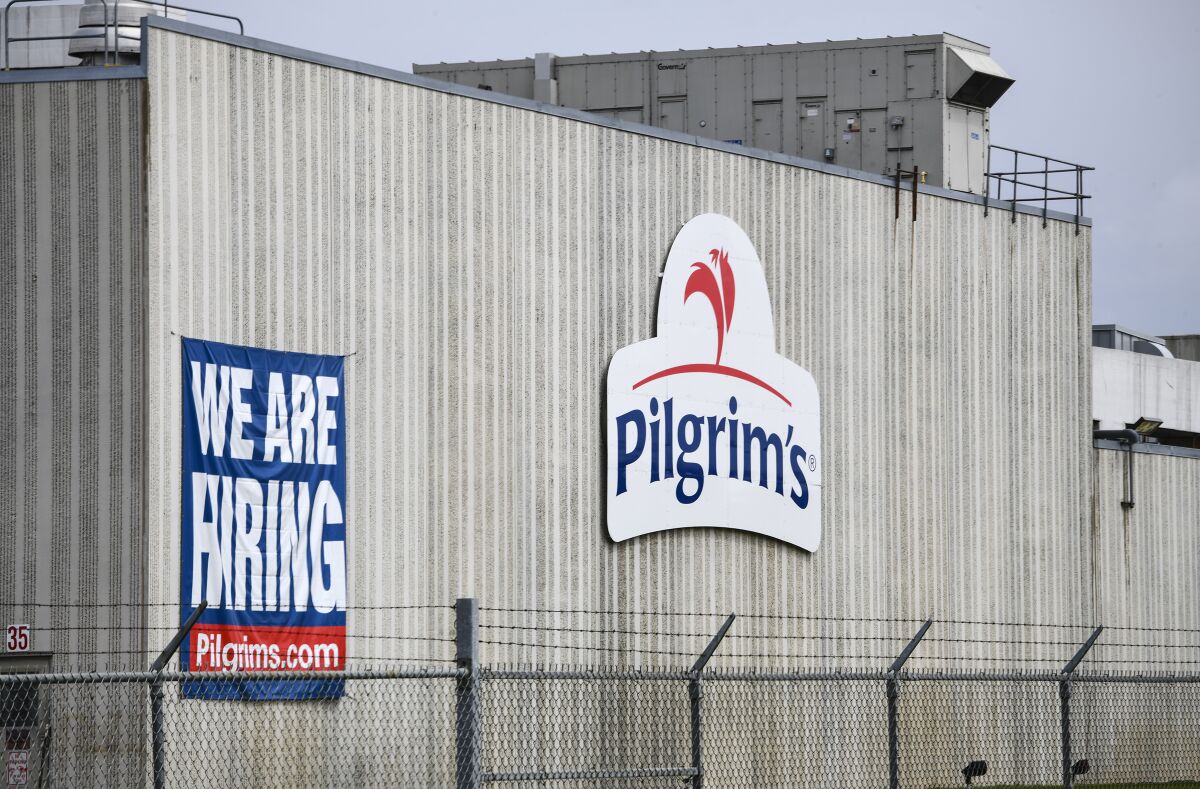 FILE - This April 28, 2020, file photo shows a Pilgrim's Pride plant in Cold Spring. Minn. Five executives of the chicken industry have been found not guilty of conspiring to fix prices. A jury in a Denver federal court acquitted former Pilgrim’s Pride CEOs Jayson Penn and William Lovette; Roger Austin, a former Pilgrim’s vice president; Mikell Fries, president of Claxton Poultry and Scott Brady, a Claxton vice president. (Dave Schwarz/St. Cloud Times via AP, File)