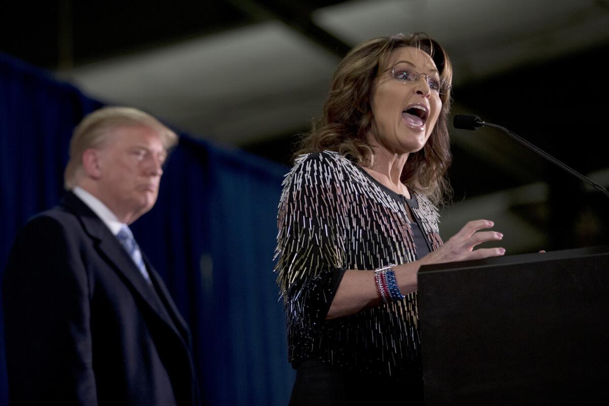 Former Alaska Gov. Sarah Palin endorses Republican presidential candidate Donald Trump during a rally at Iowa State University. Palin is returning to TV next year in her own reality court series.