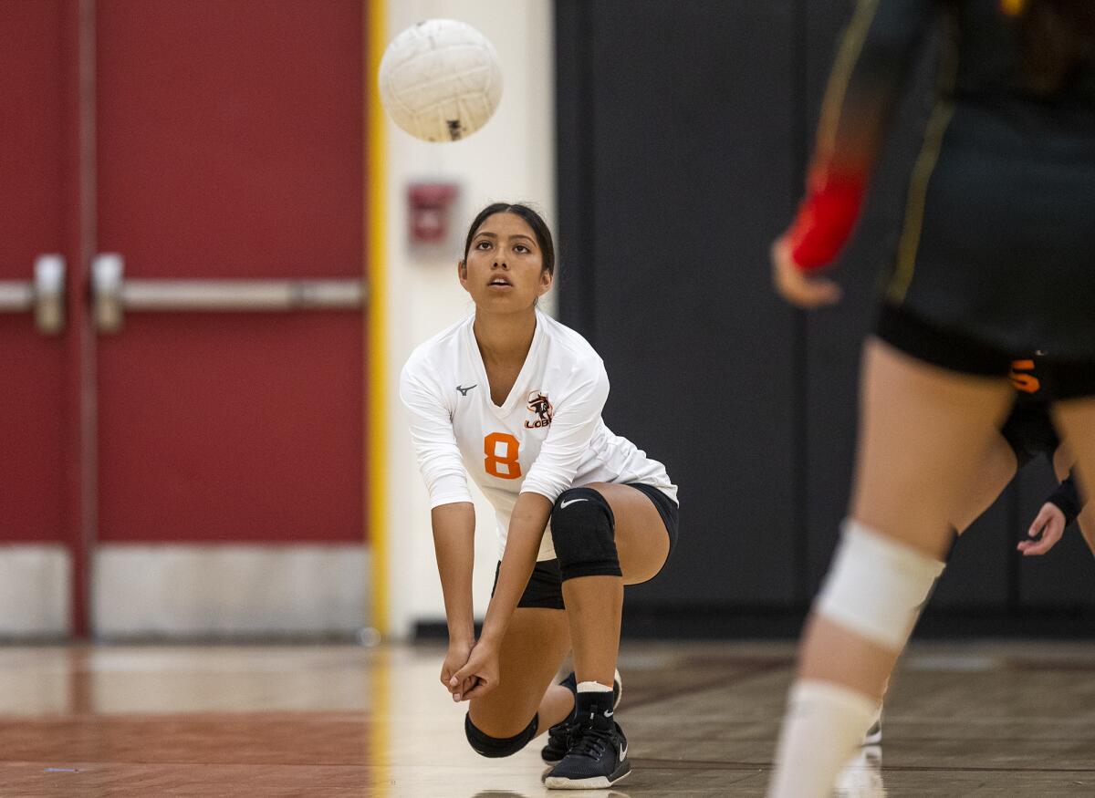 Los Amigos' Faith Montano passes a ball during a volleyball match against Estancia on Thursday.