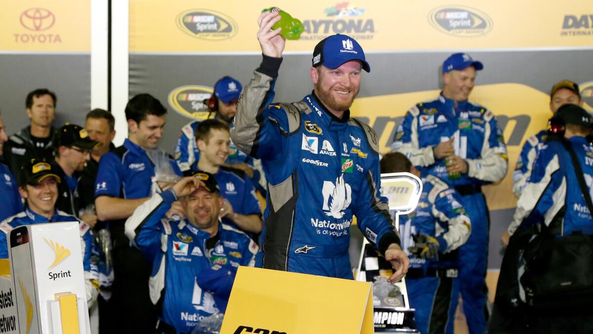 Dale Earnhardt Jr. celebrates after winning the first Can-Am Duels at Daytona International Speedway on Thursday to earn a second-row qualifying spot at the Daytona 500.