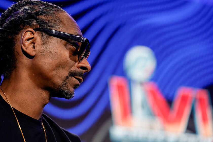 Snoop Dogg answers a question during a news conference for the Super Bowl LVI halftime show in 2022