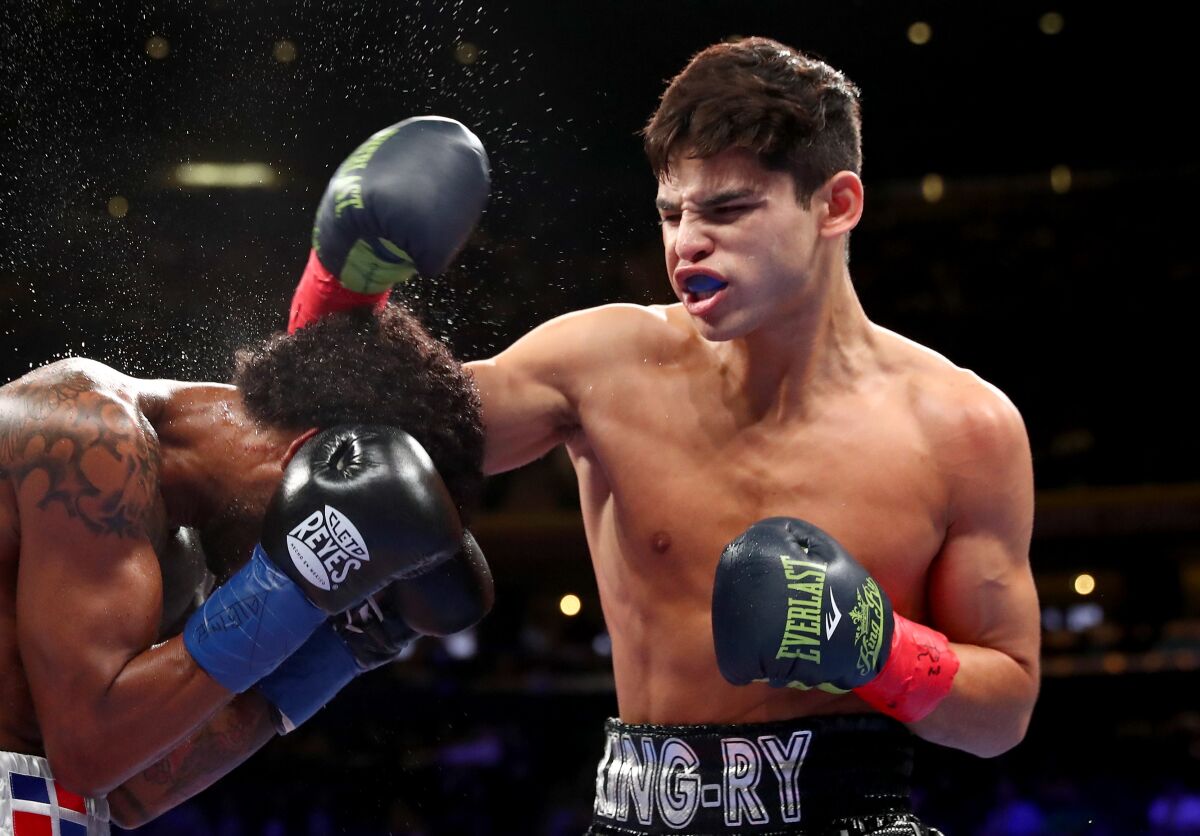 Ryan Garcia, right, lands a punch to the head of Braulio Rodriguez during their super-featherweight bout at Madison Square Garden in December.
