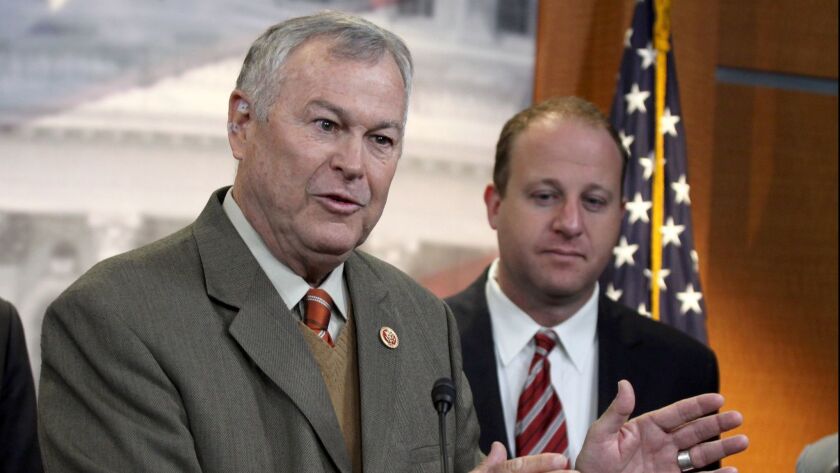 Rep. Dana Rohrabacher, R-Costa Mesa, left, accompanied by Rep. Jared Polis, D-Colo., speaks during a news conference on Capitol Hill in 2014.