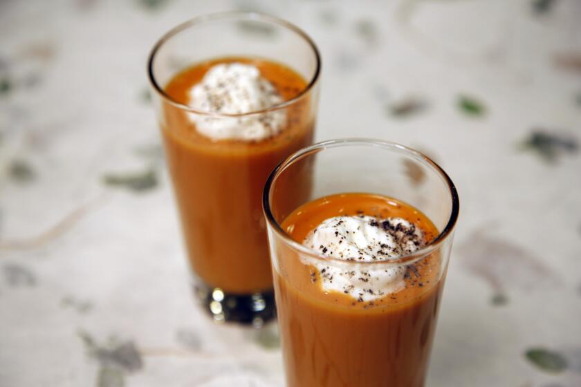 Spicy gazpacho shooters with goat cheese cream. Photographed in the Los Angeles Times test kitchen.