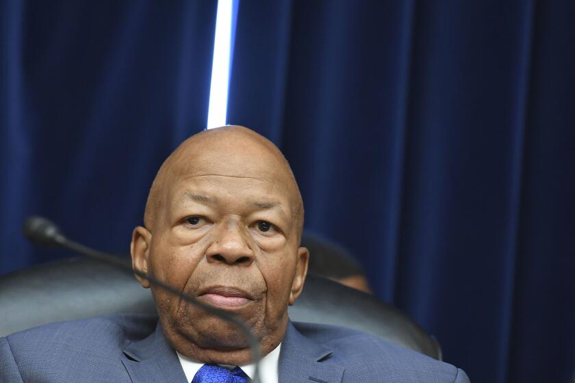 House Oversight and Reform Committee Chairman Elijah Cummings (D-Md.) arrives before Michael Cohen's testimony.