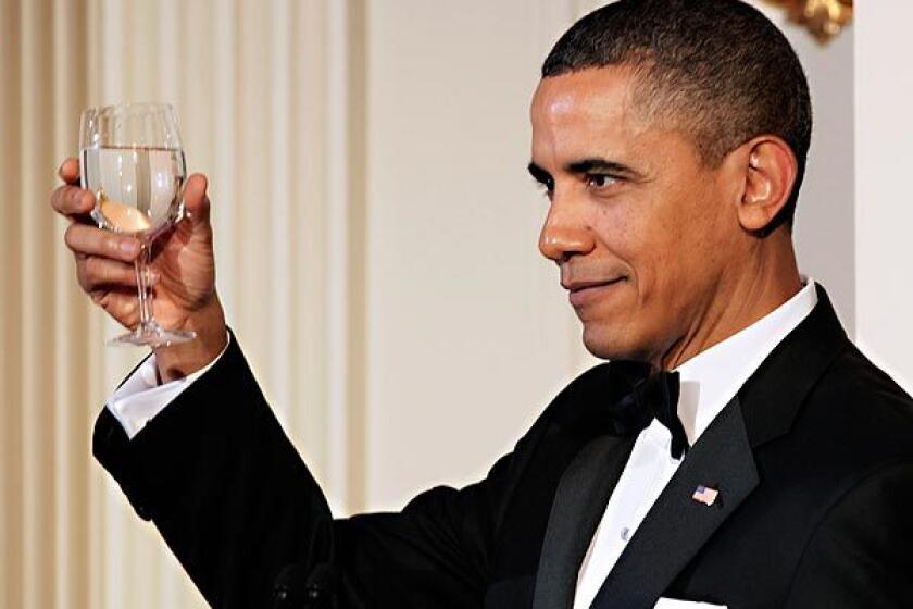 President Obama offers a toast as he and First Lady Michelle Obama hosts a state dinner for Chinese President Hu Jintao at the White House. Story: Obamas host 'quintessentially American' dinner for Hu Jintao