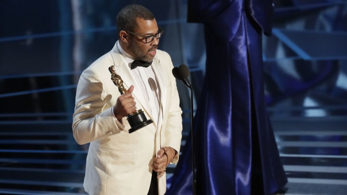 Jordan Peele accepting his original screenplay Oscar for "Get Out" during the 90th Academy Awards on March 4, at the Dolby Theatre at Hollywood & Highland Center in Los Angeles.