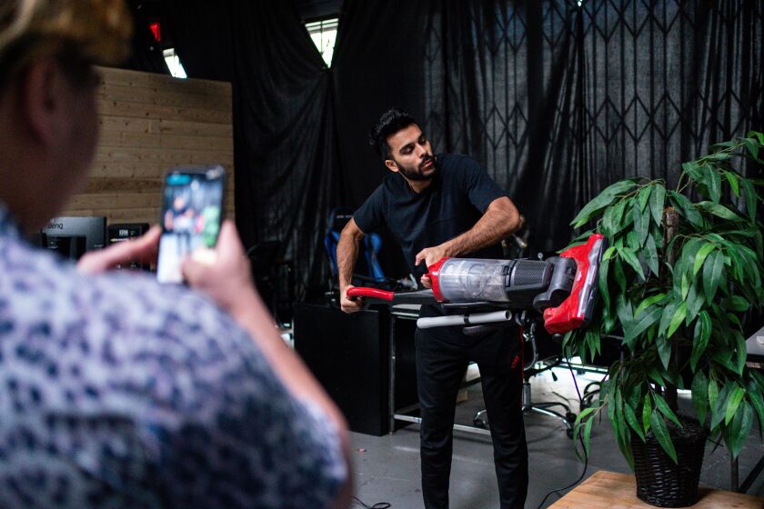 LOS ANGELES, CA - APRIL 30: Adam Waheed records a video for TikTok with Galang "Stro" To at his studio on Thursday, April 30, 2020 in Los Angeles, CA. Amid the coronavirus pandemic, content creators like Waheed have continued to find success through apps like TikTok. (Kent Nishimura / Los Angeles Times)