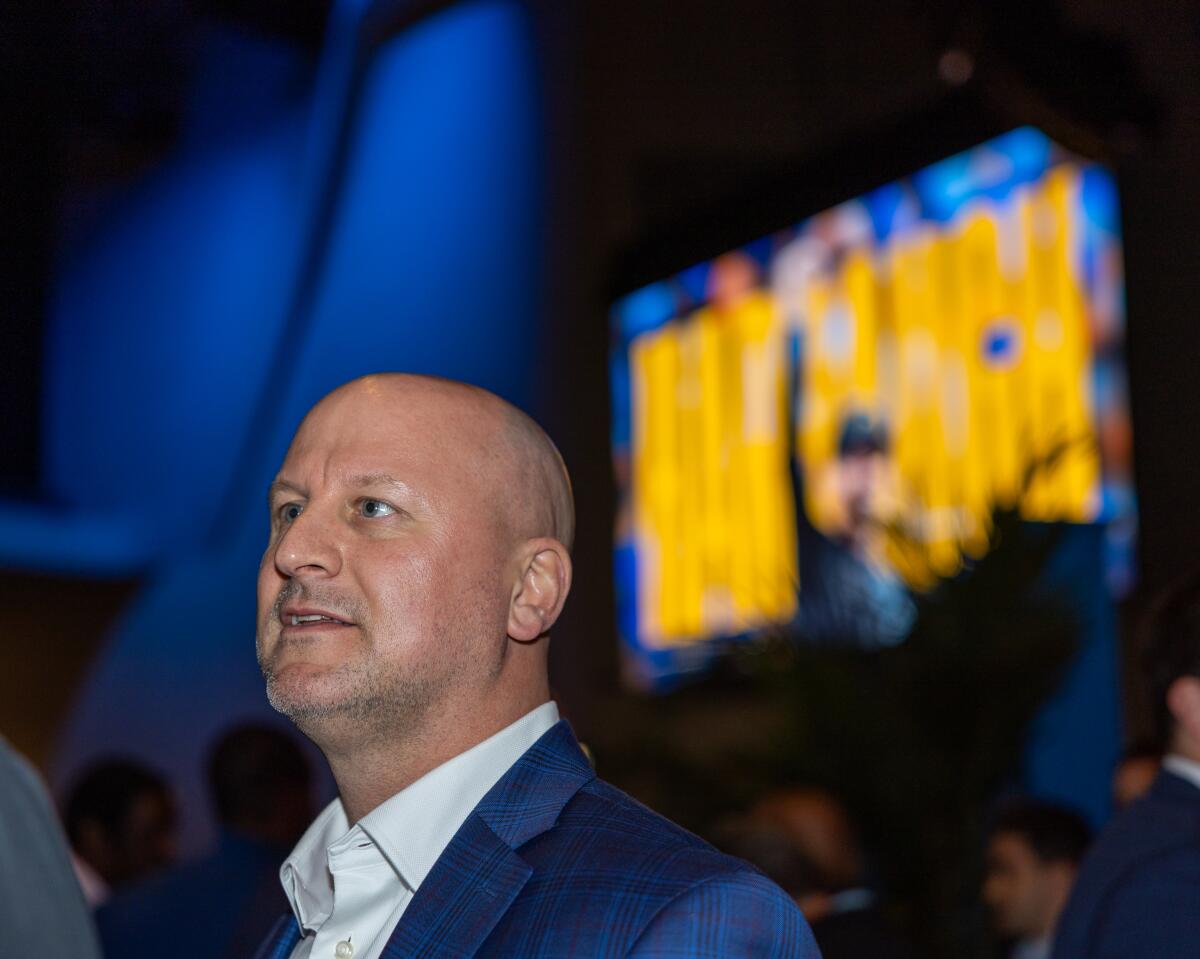 Chargers new general manager Joe Hortiz watches during a Chargers media conference to introduce coach Jim Harbaugh.