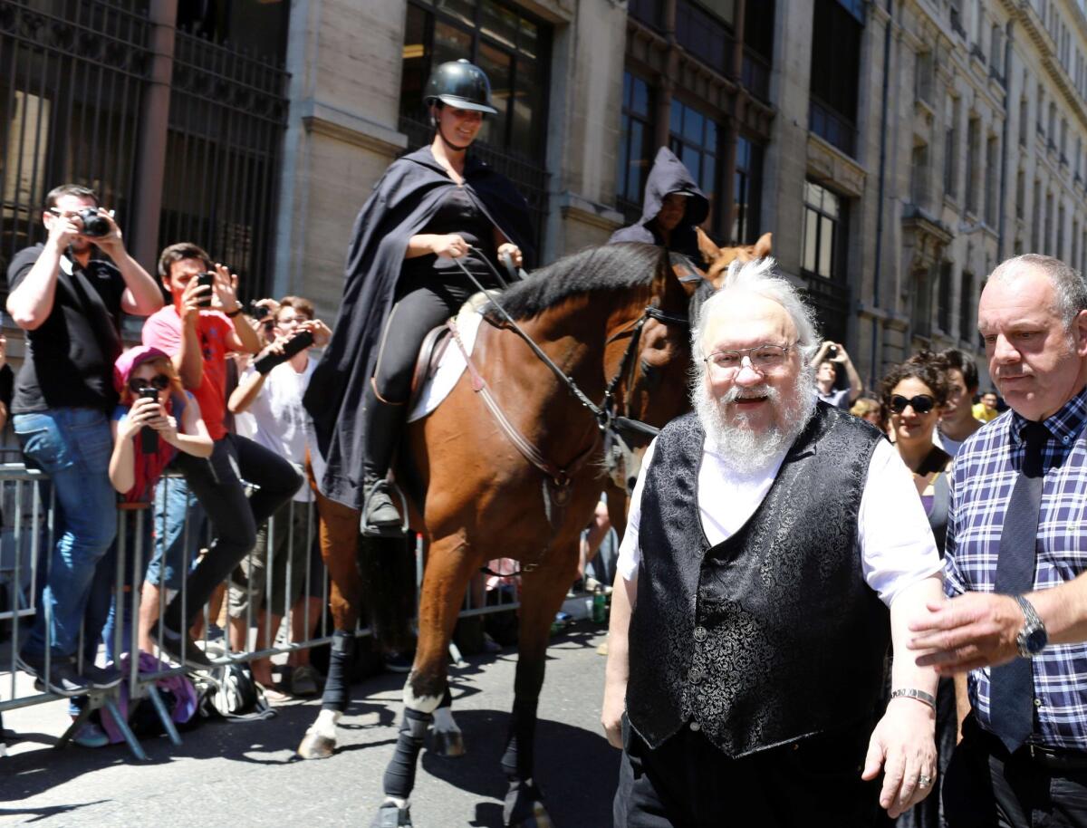 George R.R. Martin, the author of the novels upon which the hit HBO series "Game of Thrones" is based, arrives at a book signing July 3 in Dijon, France.
