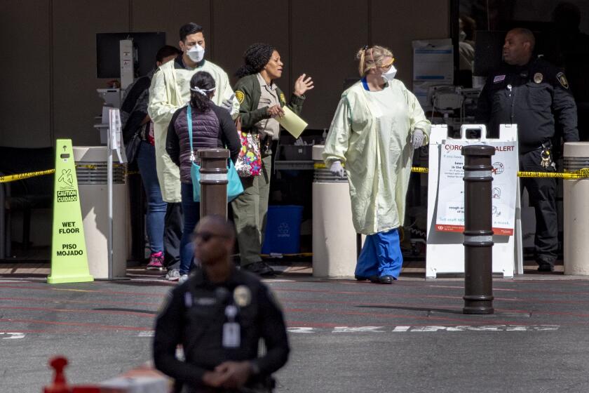 LOMA LINDA, CA - MARCH 17, 2020: Medical personnel screen patients outside the Emergency Room at Loma Linda University Health during the coronavirus pandemic on March 17, 2020 in Loma Linda, California. (Gina Ferazzi/Los AngelesTimes)
