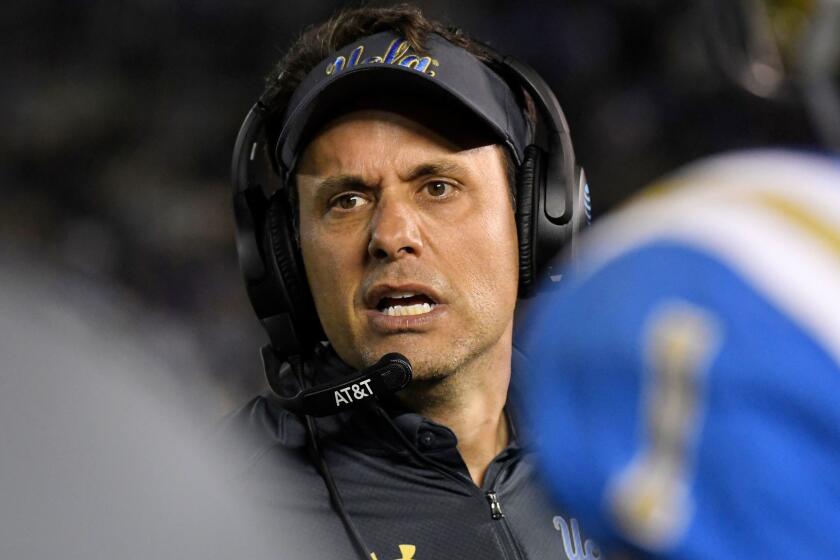 UCLA interim coach Jedd Fisch talks to his players during the first half of an NCAA college football game against California, Friday, Nov. 24, 2017, in Los Angeles. (AP Photo/Mark J. Terrill)