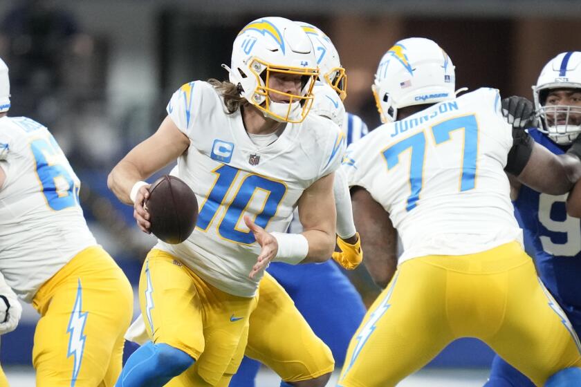 Los Angeles Chargers quarterback Justin Herbert (10) in action during the first half.