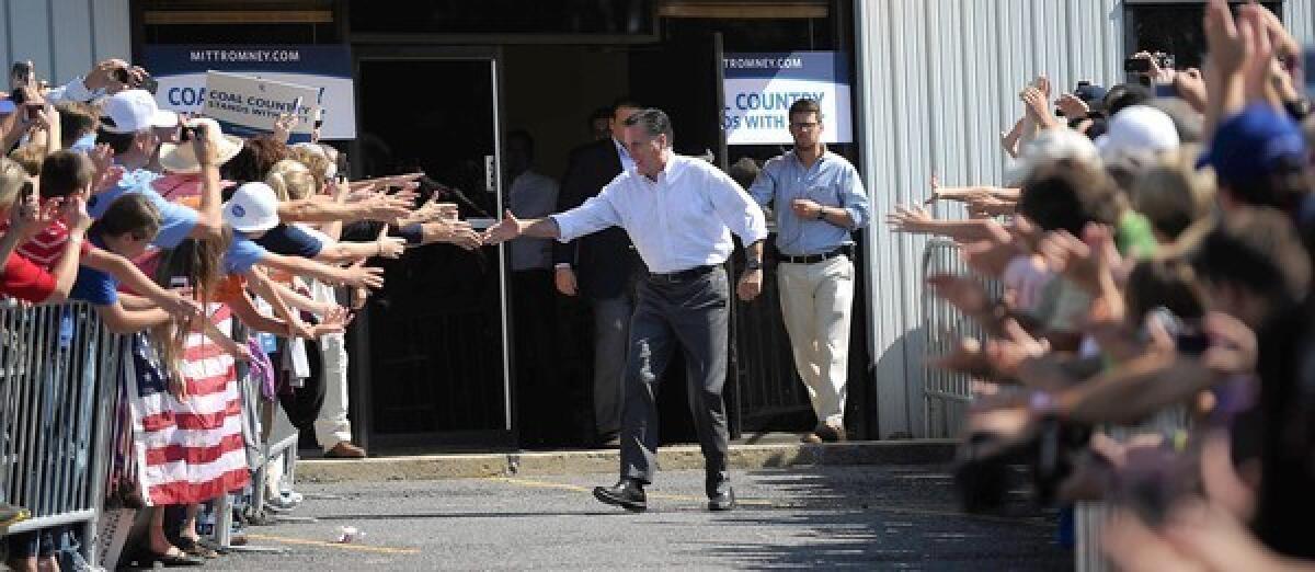 Republican presidential candidate Mitt Romney greets backers at a rally in Abingdon, Va.