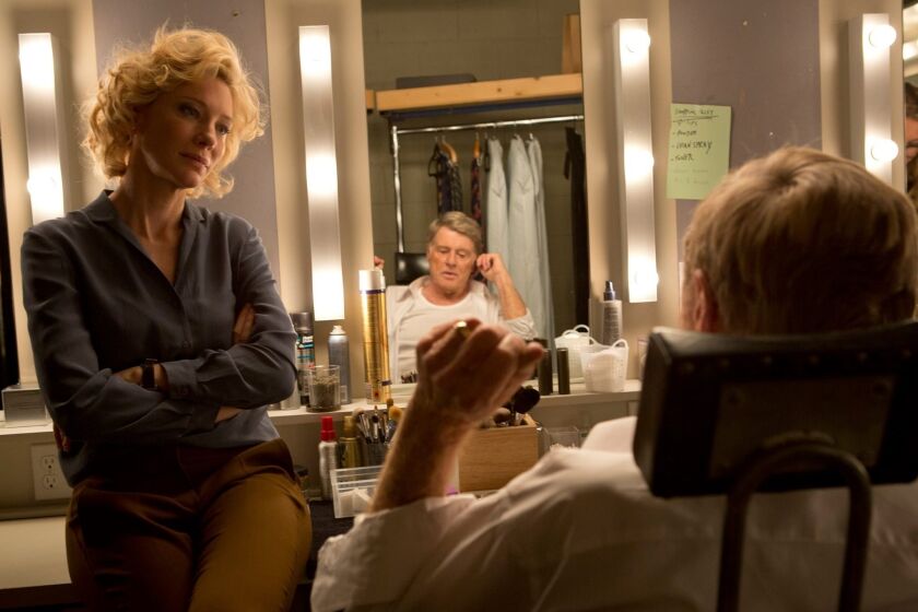Cate Blanchett portrays Mary Mapes, left, and Robert Redford portrays Dan Rather in a scene from, "Truth."