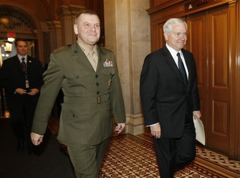 Defense Secretary Robert Gates, right, and Joint Chiefs Vice Chairman Gen. James Cartwright arrives on Capitol Hill in Washington, Wednesday, Nov. 19, 2008, for a closed session meeting with Senate Foreign Affairs Committee members regarding the new Iraq security pact. (AP Photo/Gerald Herbert)