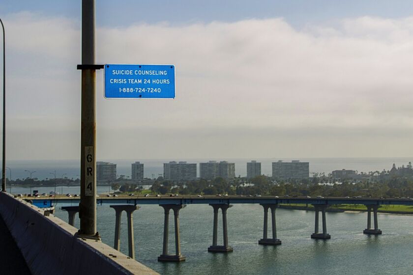The Coronado bridge has suicide help-line signs, but no barriers. A local group would like to change that.