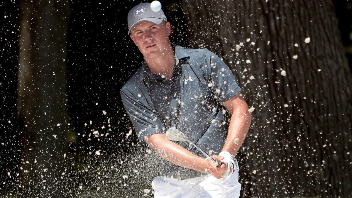 Jordan Spieth plays a bunker shot at the eighth green during the third round Friday.