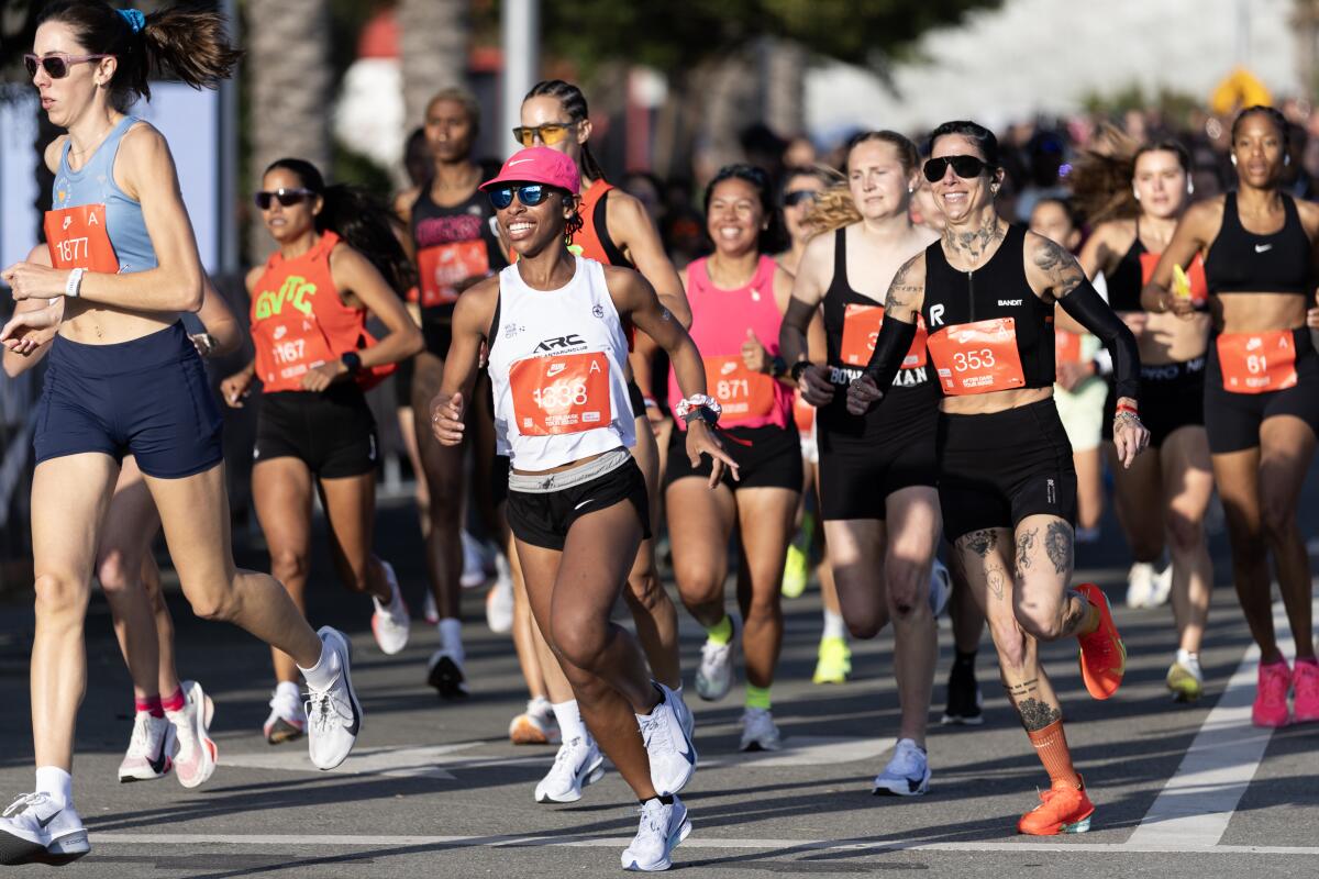 4. Runners start the Nike After Dark half-marathon at SoFi Stadium.