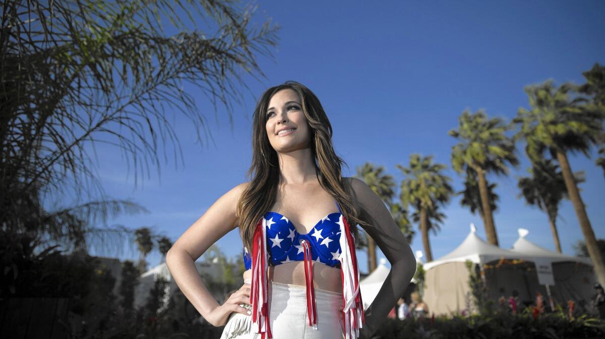 Kacey Musgraves poses before performing on the Mane Stage on April 24, 2015, at the first day of the Stagecoach Country Music Festival at the Empire Polo Club in Indio, Calif.