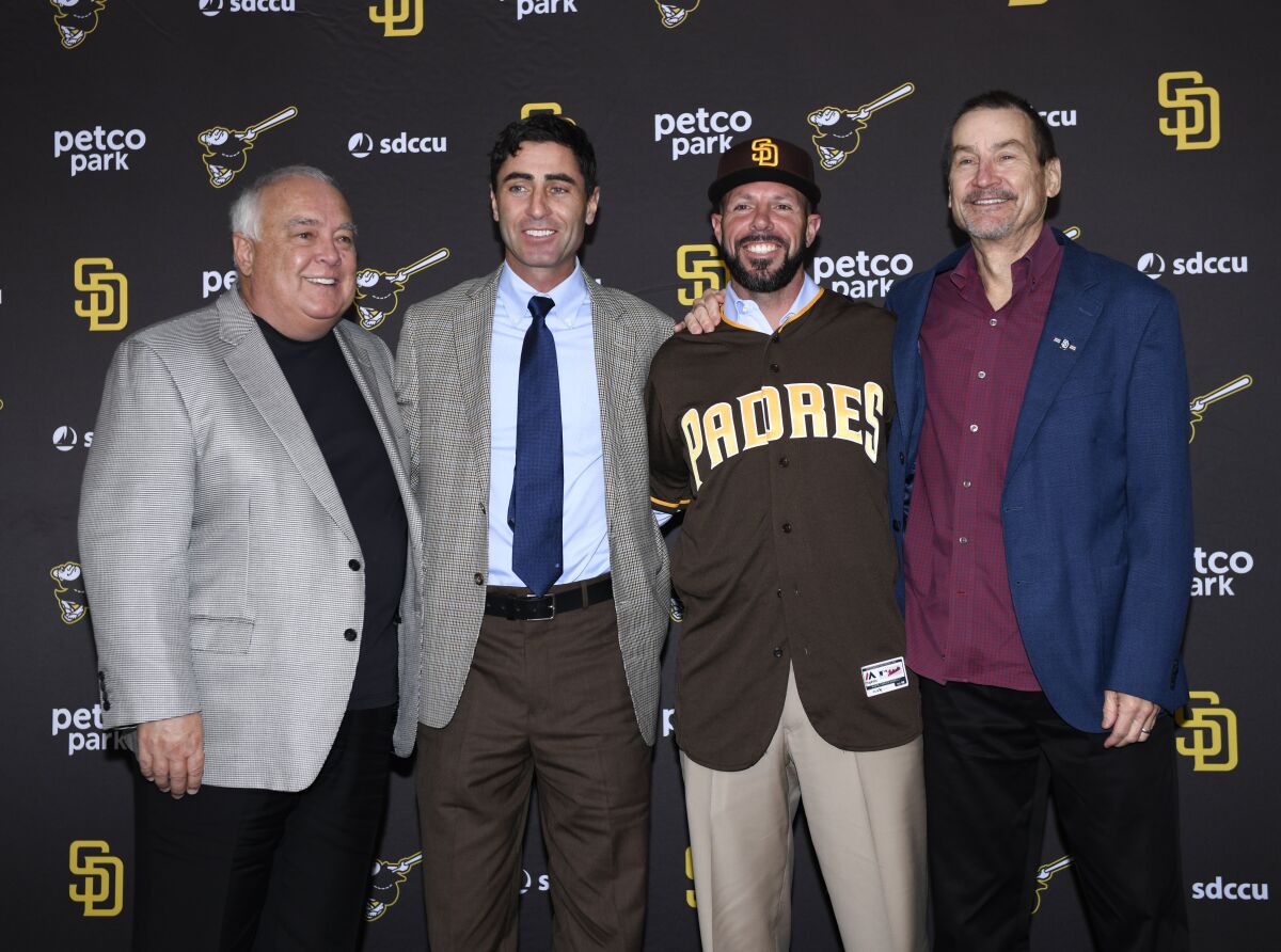 Padres Chairman Peter Seidler, far right, stands with (L-R) Vice Chairman Ron Fowler, GM A.J. Preller and Jayce Tingler