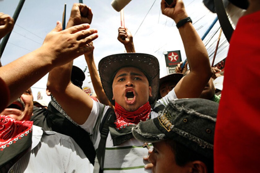 Supporters of ousted President Manuel Zelaya march to the airport in Tegucigalpa, the capital, but his plane was blocked from landing there. His replacement, Roberto Micheletti, has promised to arrest him if he returns.
