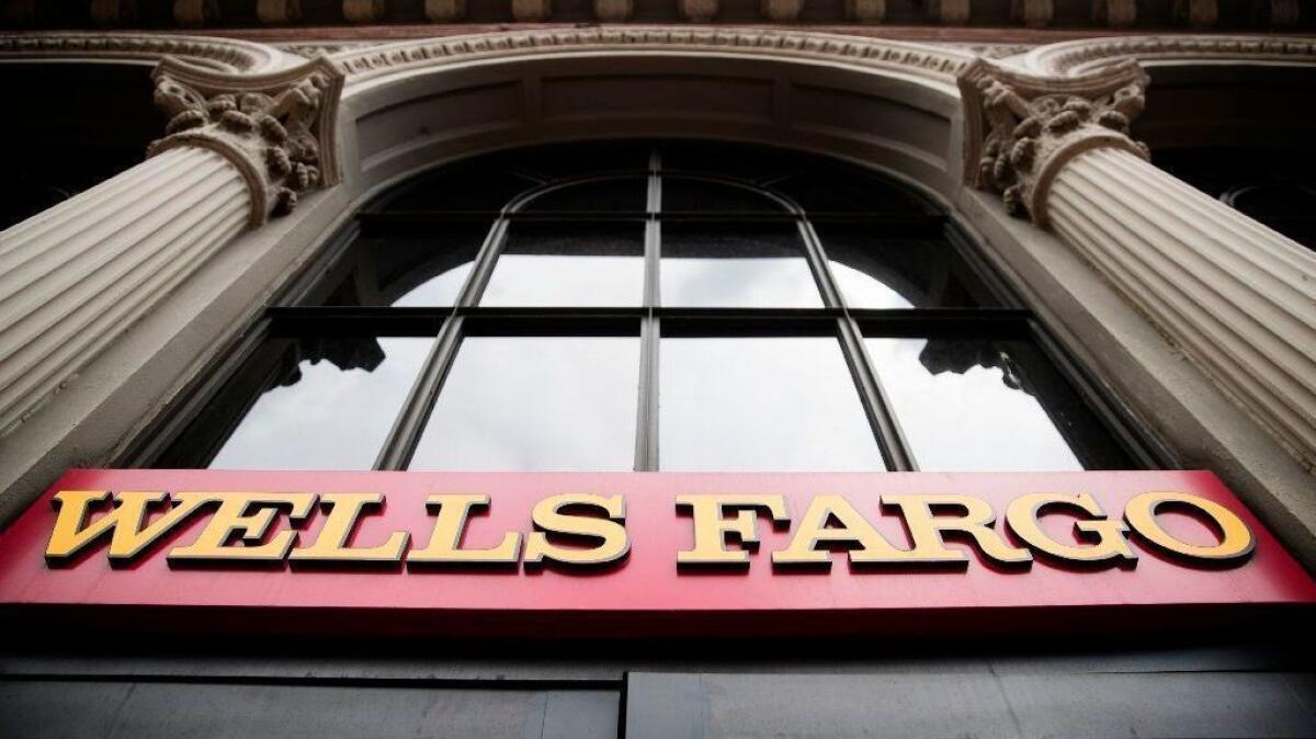 Wells Fargo & Co. will probably remain under a Federal Reserve enforcement action into early next year, the bank's CEO said Thursday.