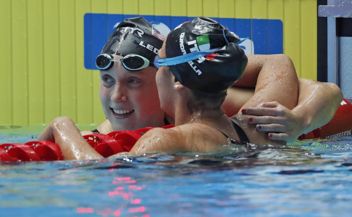U.S. swimmer Katie Ledecky is congratulated by Italy's Simona Quadarella.