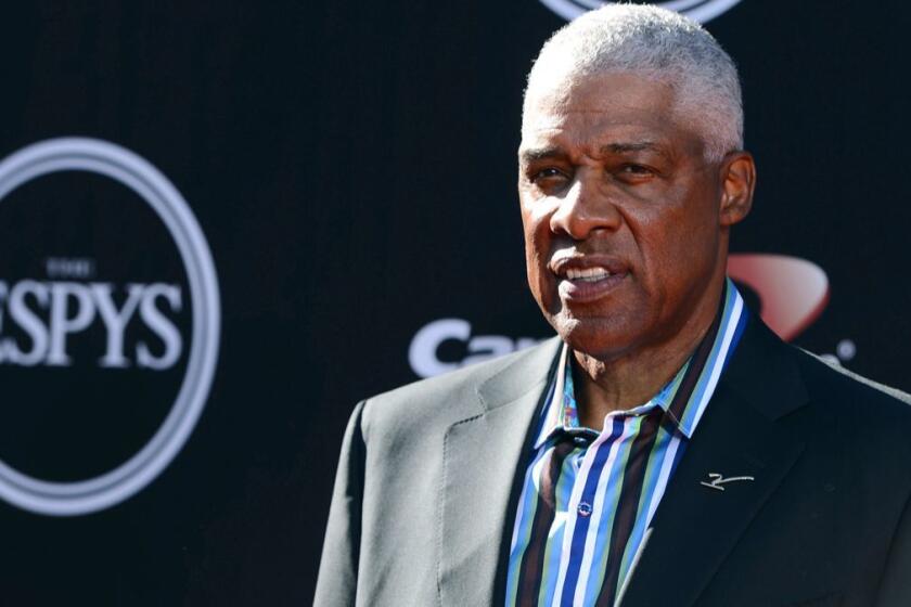 FILE - In this July 16, 2014 file photo, NBA legend Julius Erving arrives at the ESPY Awards at the Nokia Theatre in Los Angeles. Erving fell ill at the Philadelphia 76ers' game Friday, Jan. 5, 2018 and was taken to a hospital. There was no immediate update on his condition. (Photo by Jordan Strauss/Invision/AP, File)