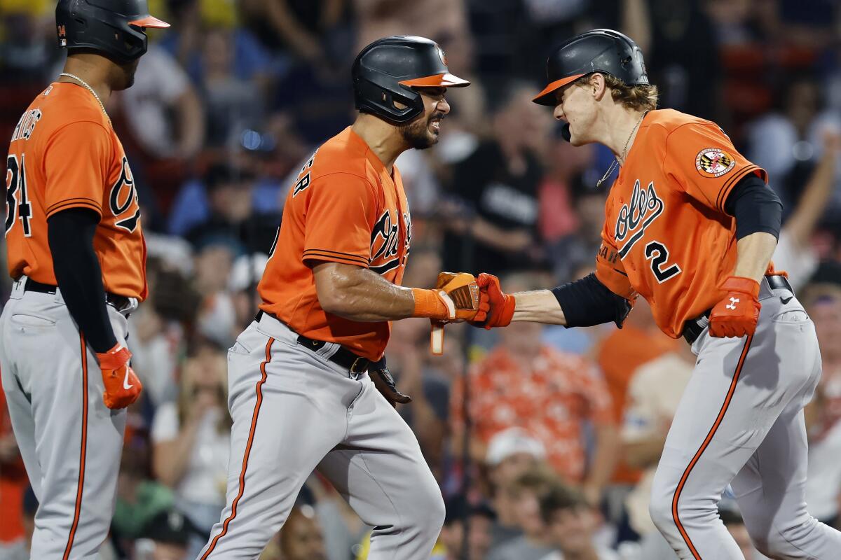 Orioles hang on to beat Red Sox 13-12 for 7th straight win as McCann homers  twice