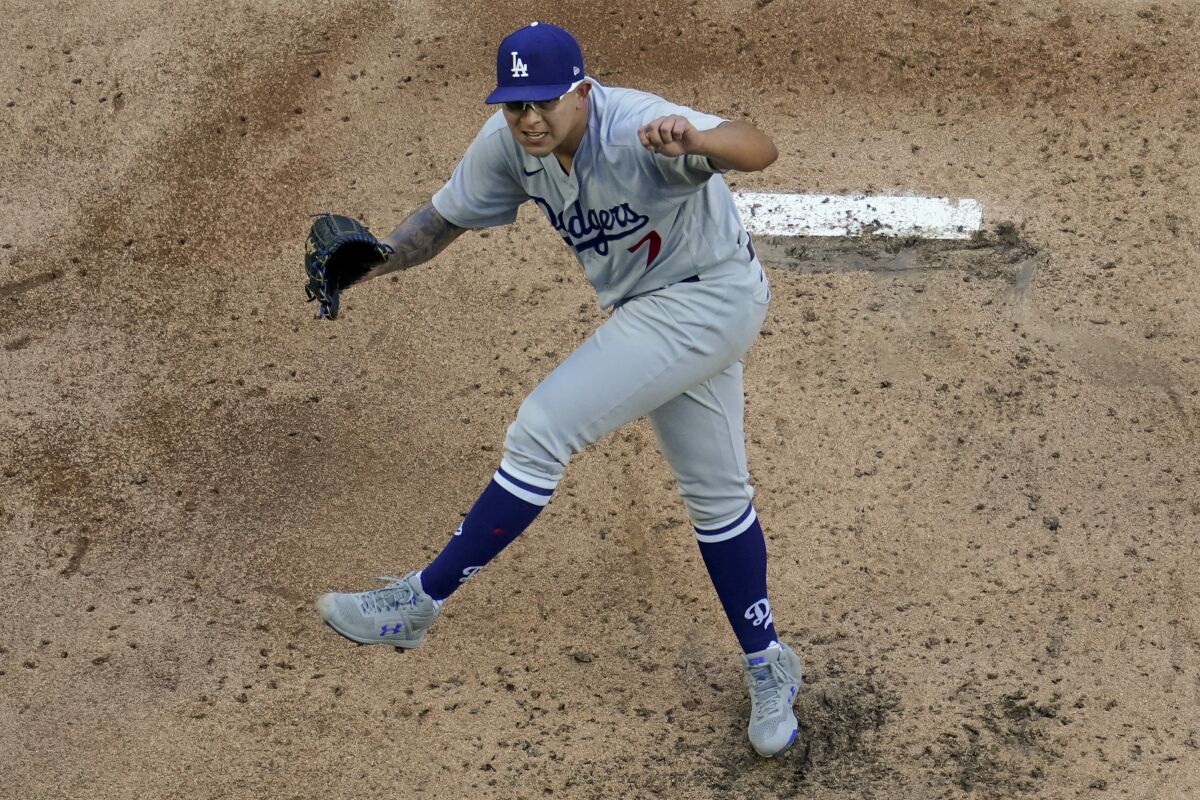 Los Angeles Dodgers starting pitcher Julio Urias throws against the Atlanta Braves during the first inning in Game 3.