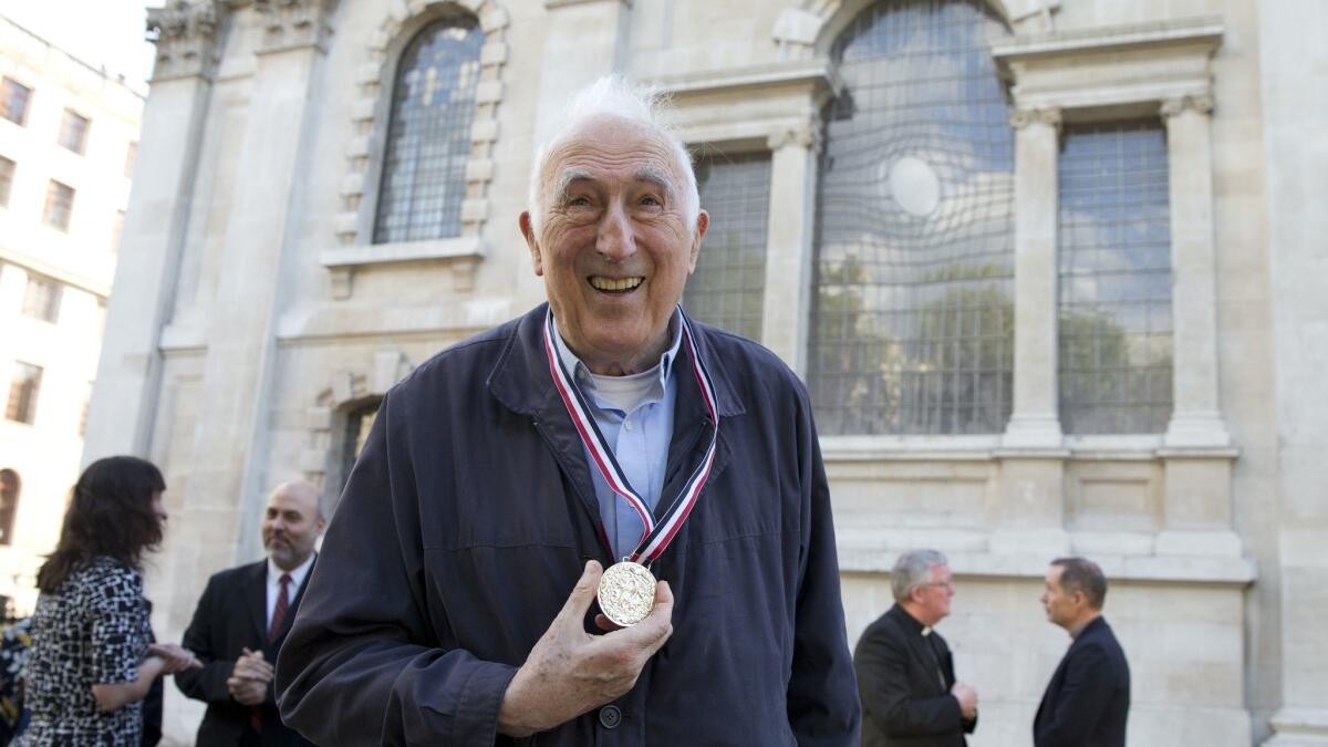 Jean Vanier, founder of L'Arche charity, wears the Templeton Prize medal he won in 2015.