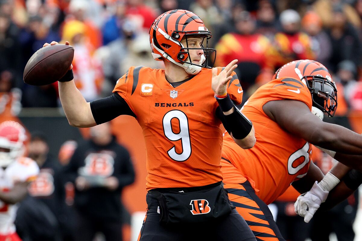 Joe Burrow aims a pass in Bengals' 34-31 victory against the Kansas City Chiefs on Sunday in Cincinnati.