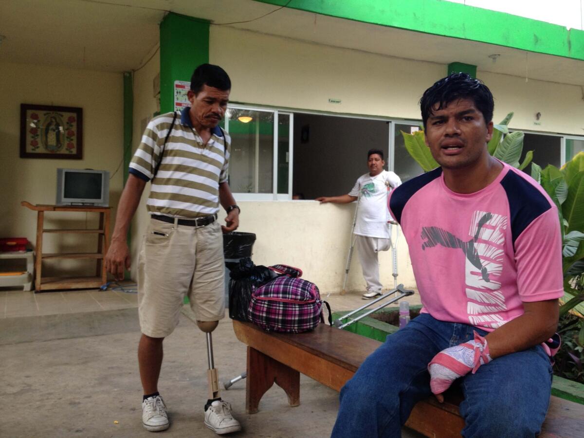 Wilfredo Filiu, 46, left, Jose Luis Hernandez, 28, and Benito Murillo, 43, center, are members of the Assn. of Returned Migrants with Disabilities. All three men lost limbs after being run over by the freight train known as La Bestia -- the Beast.