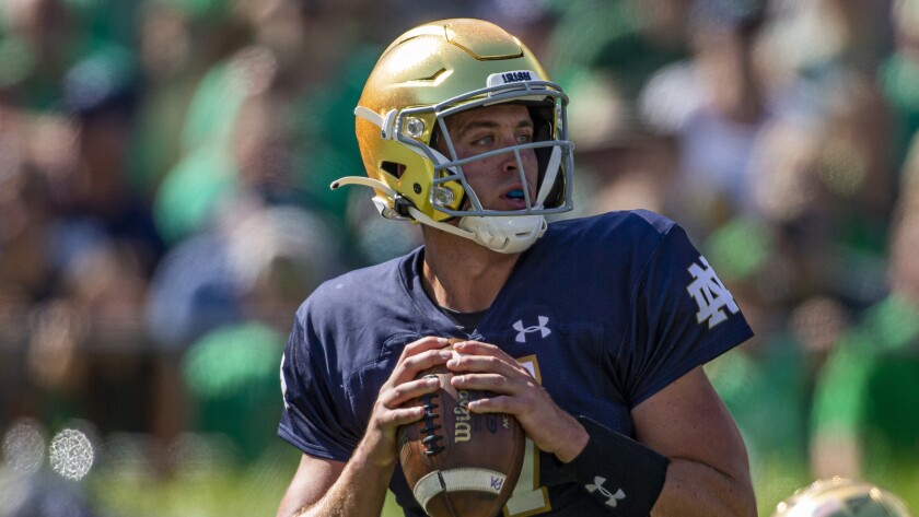 Notre Dame quarterback Jack Coan drops back to pass against Purdue