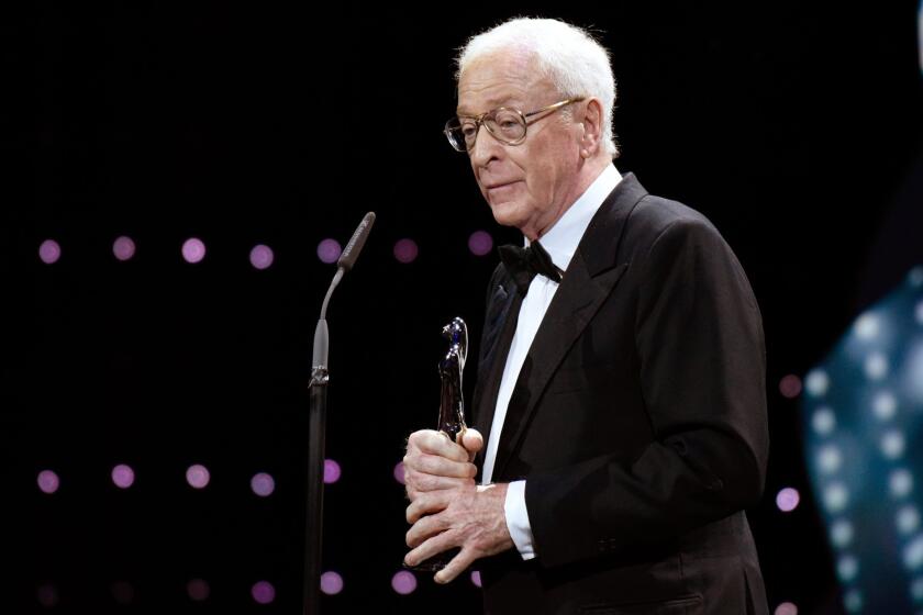 Michael Caine accepts an award Saturday at the European Film Awards in Berlin.