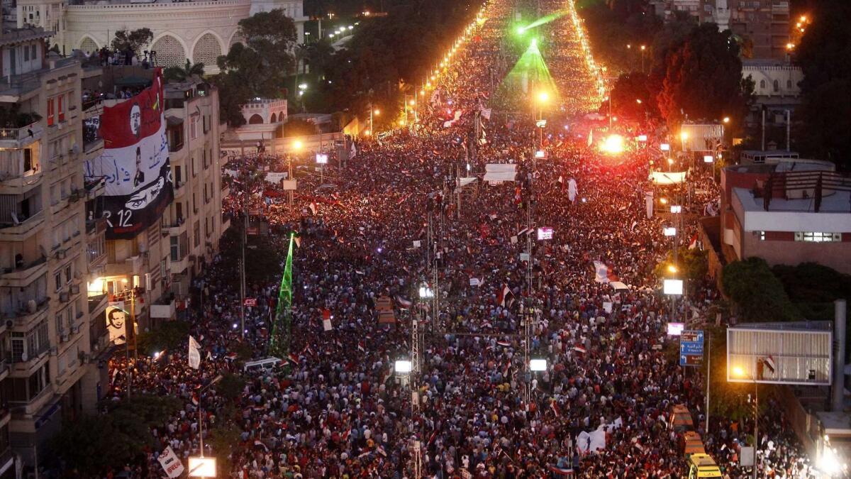 Tens of thousands of demonstrators gather outside the presidential palace in Cairo calling for the ouster of President Mohamed Morsi in 2013.